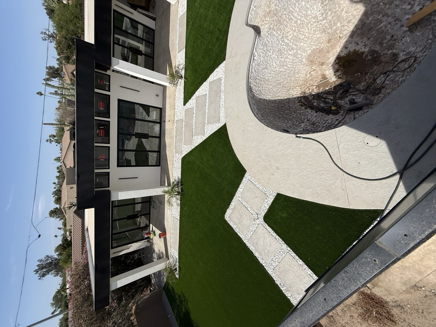 Circular paver courtyard with modern home